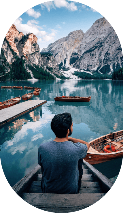 Man rowing his boat through a peaceful river